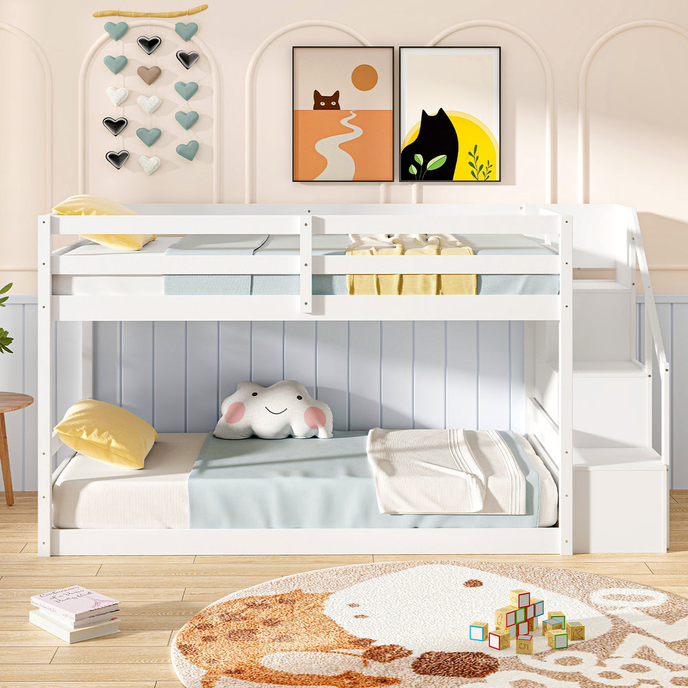 Twin over twin low bunk bed in white with storage stairs, solid wood frame, ideal for kids' rooms and organization.