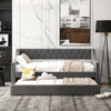 Twin size gray daybed with trundle, featuring curved armrests and rivet accents, perfect for space-saving sleep.