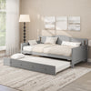 Twin size gray daybed with trundle on wheels, featuring solid pine wood frame and elegant design for versatile use.