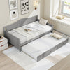 Twin size gray daybed with trundle on wheels, featuring a solid pine wood frame and elegant design for versatile use.