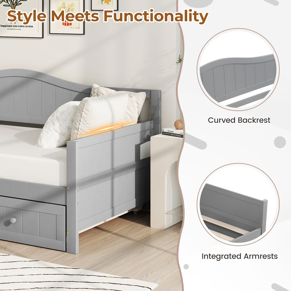 Twin size gray daybed with trundle, featuring integrated armrests and curved backrest for versatile use in any room.