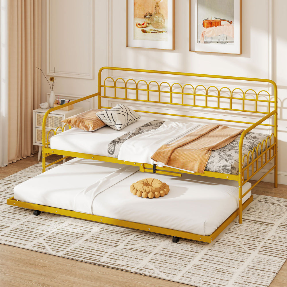 Twin size golden metal daybed with trundle shown in a stylish living room, perfect for accommodating overnight guests.