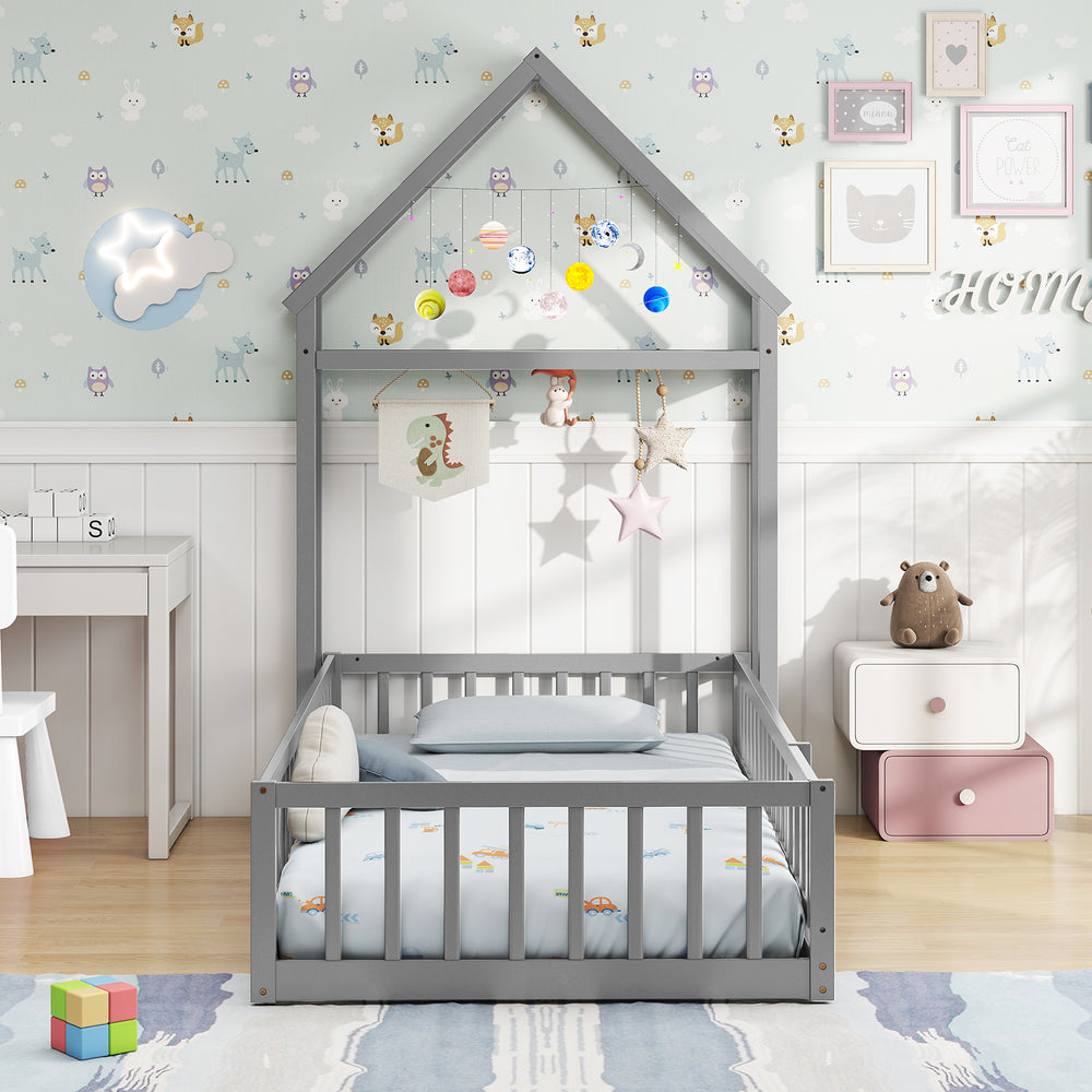 Twin size gray house floor bed with house-shaped headboard, low-to-ground design, and secure guardrails for kids'.