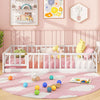Twin size white Montessori floor bed with fence and door, designed for safety and easy access, perfect for kids' play.