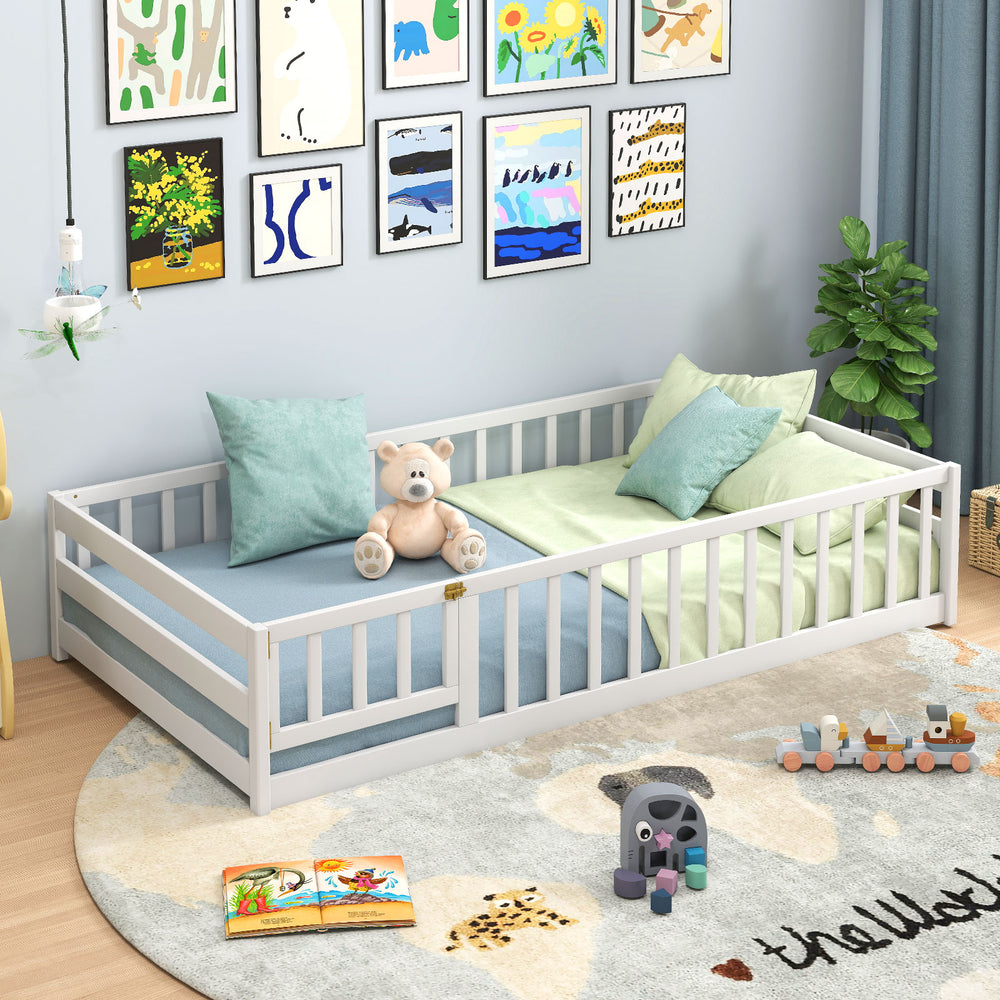 Twin size kids Montessori floor bed in white, featuring plush bedding, perfect for creating a cozy play and sleep area.