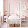 Twin size white metal canopy bed frame with decorative headboard and footboard, perfect for personalized sleep spaces.