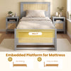 Twin size gray rattan bed frame with two storage drawers and embedded platform for non-sliding mattress placement.