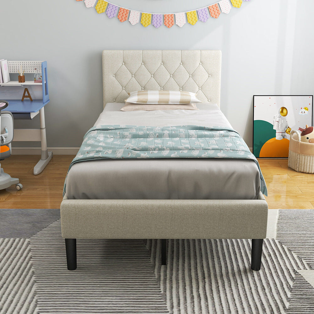 Twin size upholstered platform bed in beige with button tufted headboard, perfect for bedrooms or dorms.