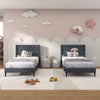 Twin size upholstered platform beds with button tufted gray headboards, perfect for children's bedrooms or guest rooms.