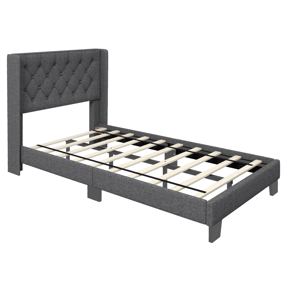Upholstered twin size platform bed with button tufted headboard and solid wooden slats for stability and support.