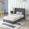 Twin size upholstered platform bed showcasing a high-density sponge padded headboard and solid wooden slats for support.