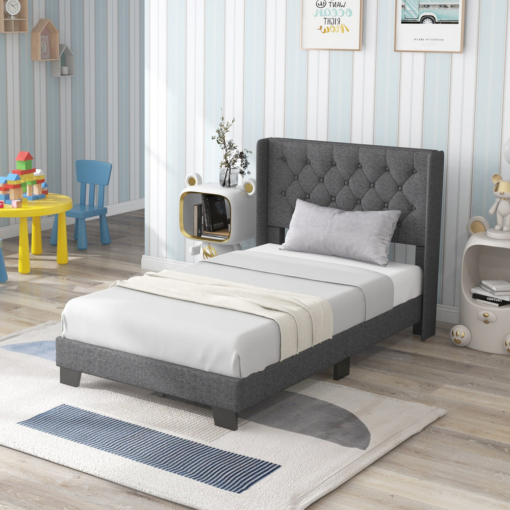 Twin size upholstered platform bed showcasing a high-density sponge padded headboard and solid wooden slats for support.
