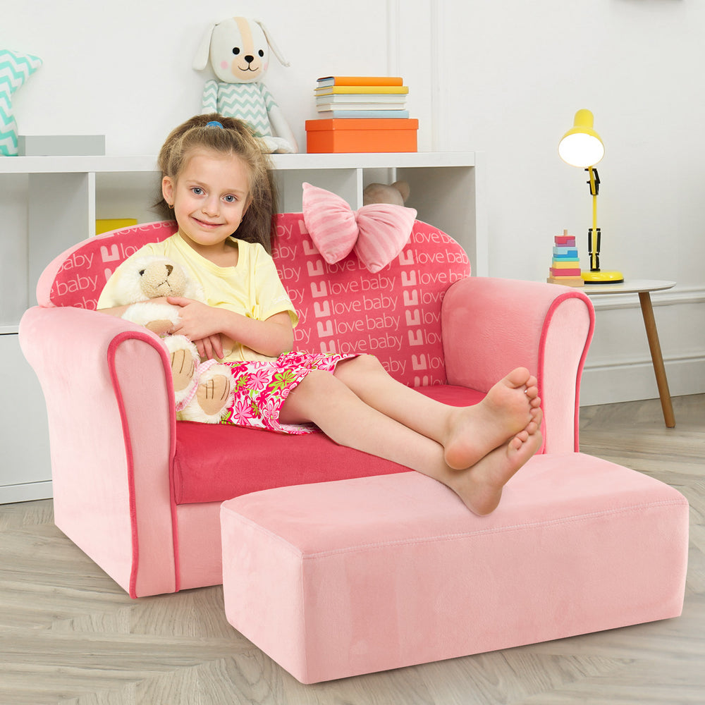 Ultra soft pink kids sofa chair with ottoman, designed for toddlers, featuring a cozy velvet finish and decorative bow.