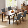Gray upholstered accent chairs with high back and solid wooden frame, perfect for dining or living room comfort.