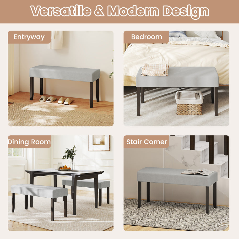 Gray upholstered entryway bench with padded seat and solid rubber wood legs, perfect for bedroom or dining room use.