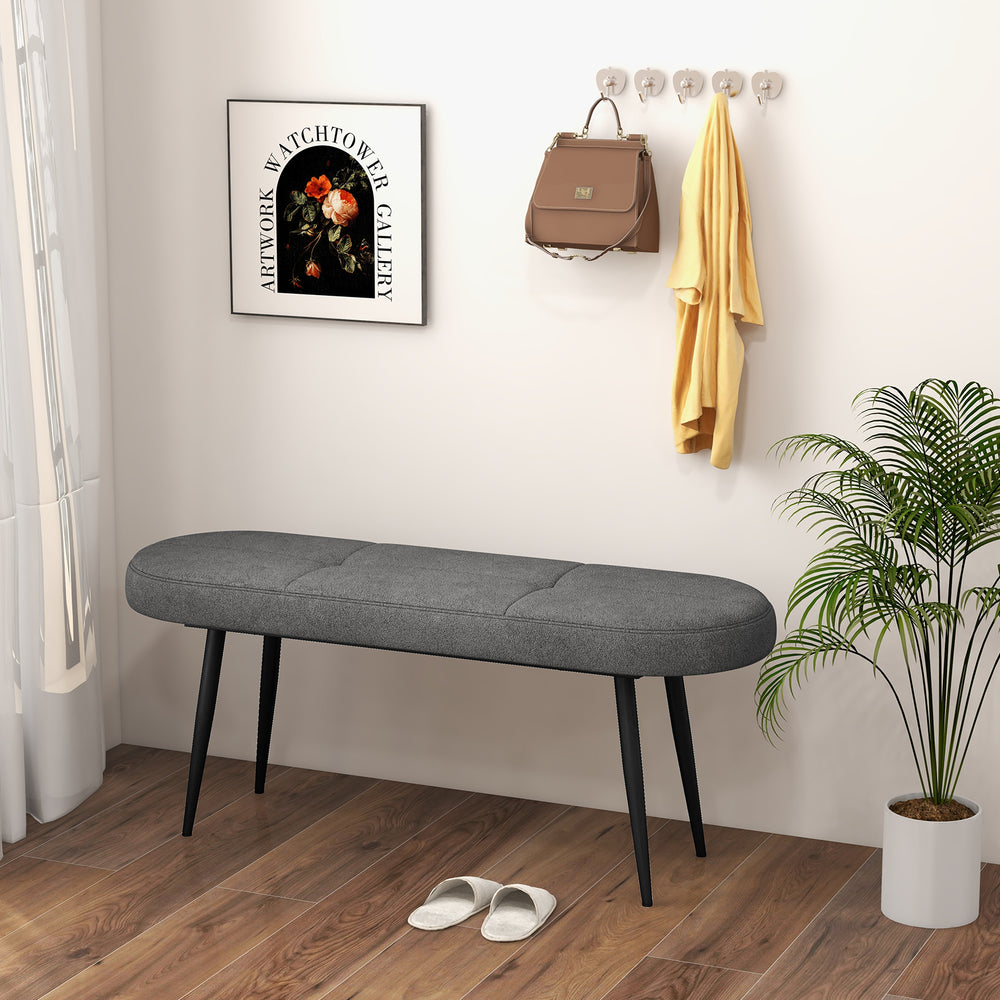 Gray upholstered entryway bench with heavy-duty metal frame, button tufted design, ideal for comfortable seating.