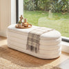 Upholstered fabric storage ottoman bench in white with lift-top lid, ideal for end of bed or entryway use.