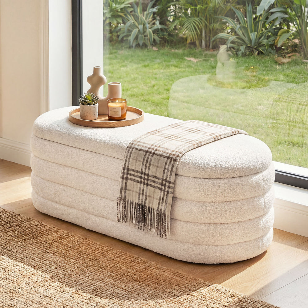 Upholstered fabric storage ottoman bench in white with lift-top lid, ideal for end of bed or entryway use.