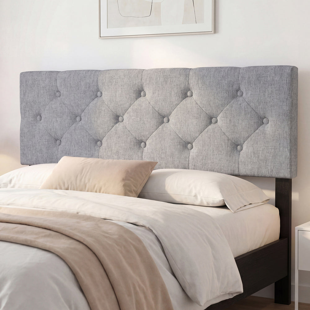 Tufted gray upholstered headboard for queen/full size beds, featuring soft cushioning and adjustable width options.