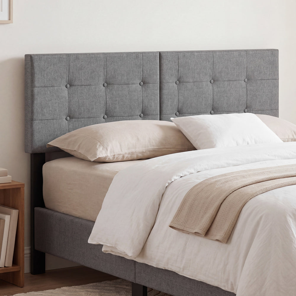 Upholstered headboard with adjustable width, showcasing a cozy linen fabric and tufted design for stylish bedroom decor.