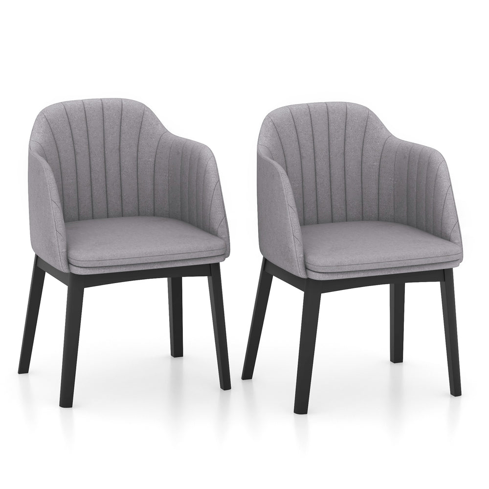 Set of 2 grey upholstered velvet dining chairs with curved backrests and solid rubber wood frames for versatile seating.