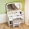 Vanity desk makeup table in white with LED lights, curved mirror, and stool, featuring storage drawers and charging.