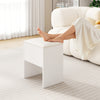 White vanity stool with a cushioned seat and hidden storage, perfect for small spaces and versatile use.