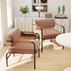 Velvet upholstered accent chairs with cylindrical backrests and metal armrests, ideal for living room or home office.