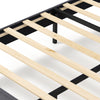 Close-up of wooden slats on a velvet upholstered platform bed frame with adjustable headboard for enhanced support.