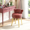 Velvet vanity chair in pink with tufted low back and solid wood legs, perfect for elegant dressing tables.