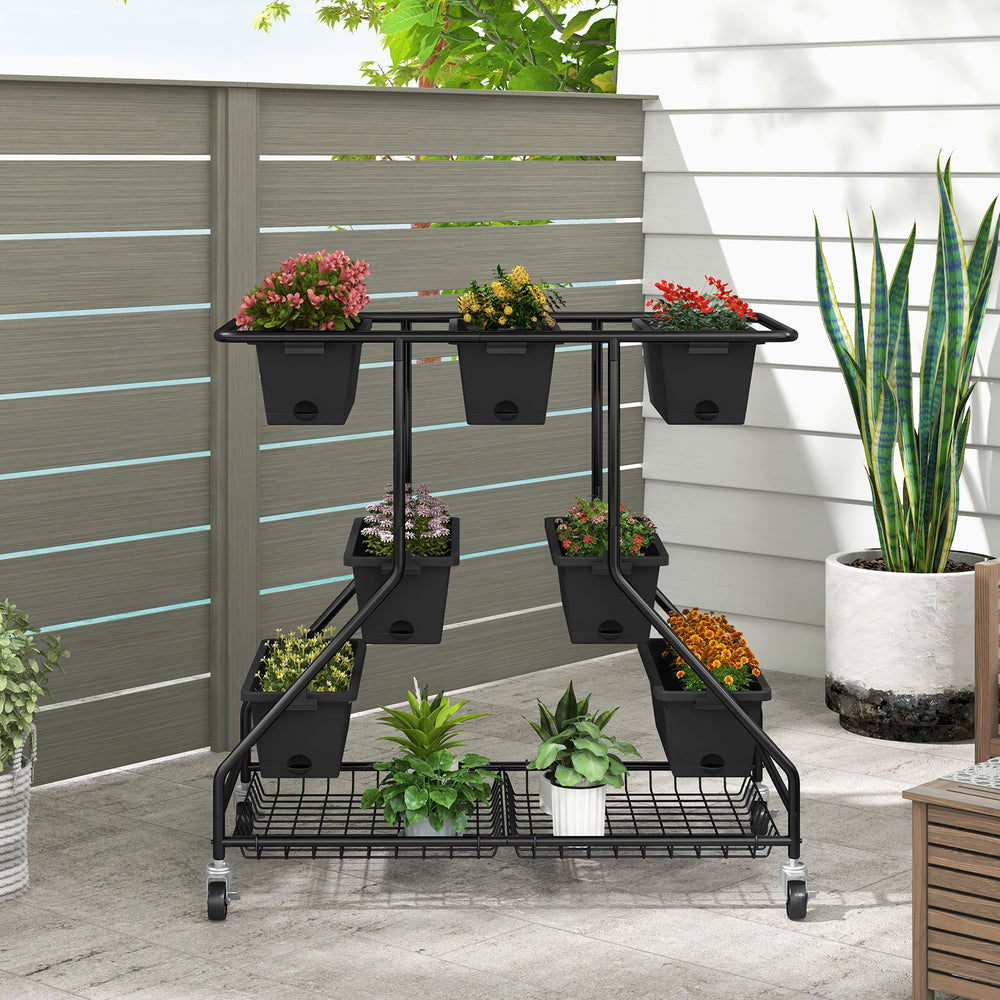 Vertical raised garden bed with staggered planter boxes and detachable storage baskets, designed for optimal sunlight.