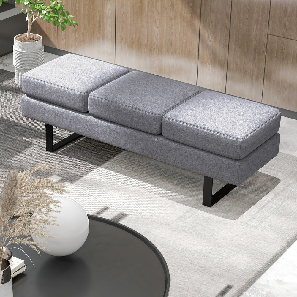 Gray waiting room bench seating with removable cushions and metal frame, designed for comfort and stability.