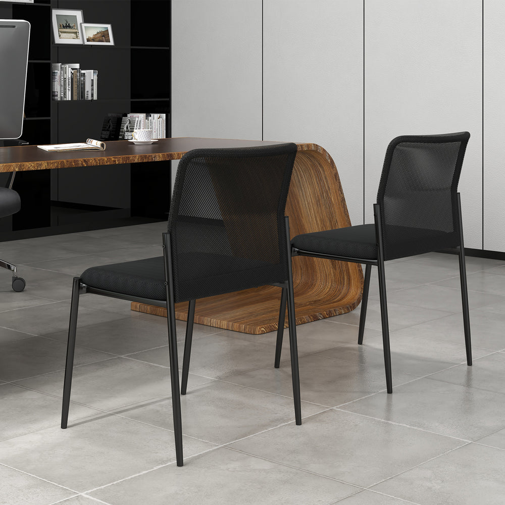 Side view of two stackable black waiting room chairs featuring ergonomic mesh backrests and padded seats for comfort.