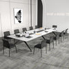 Black waiting room chair set arranged around a sleek conference table, showcasing ergonomic design and professional.