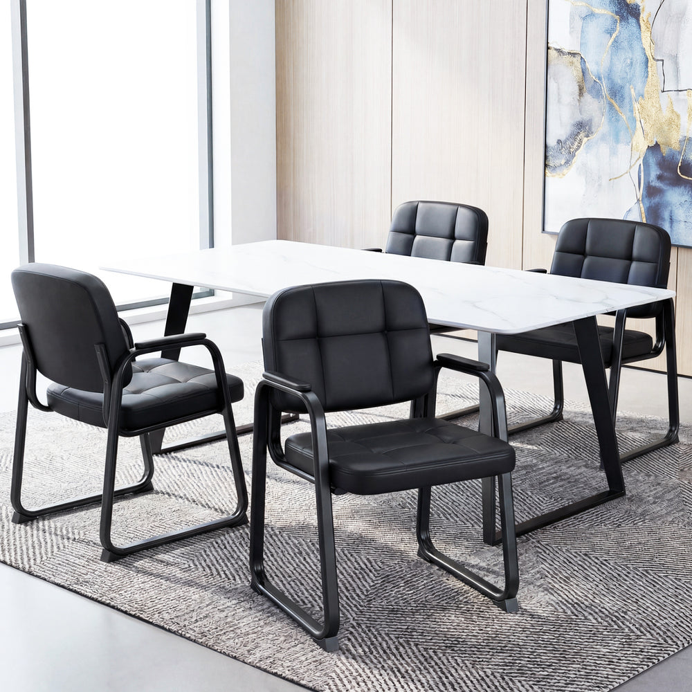 Set of 2 black leather office reception chairs with padded armrests and ergonomic backrest for comfort in waiting areas.