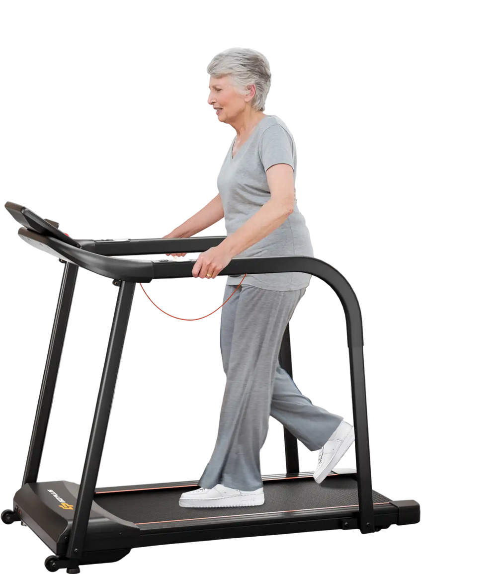 Senior using a 2.5 HP black walking treadmill with extended handrails and LED display for safe indoor exercise.