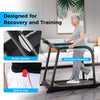 Senior using the 2.5 HP walking treadmill with extended handrails, featuring pulse sensors and safety key for secure.