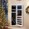 Mirrored jewelry cabinet with LED light, featuring generous storage and soft velvet lining, mounted on a wall beside a.