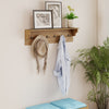 Wooden coat rack with shelf and 6 hooks, featuring natural wood grains, ideal for entryway or living room organization.