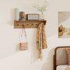 Wooden coat rack with shelf and six hooks, featuring a natural finish, ideal for entryways and living spaces.