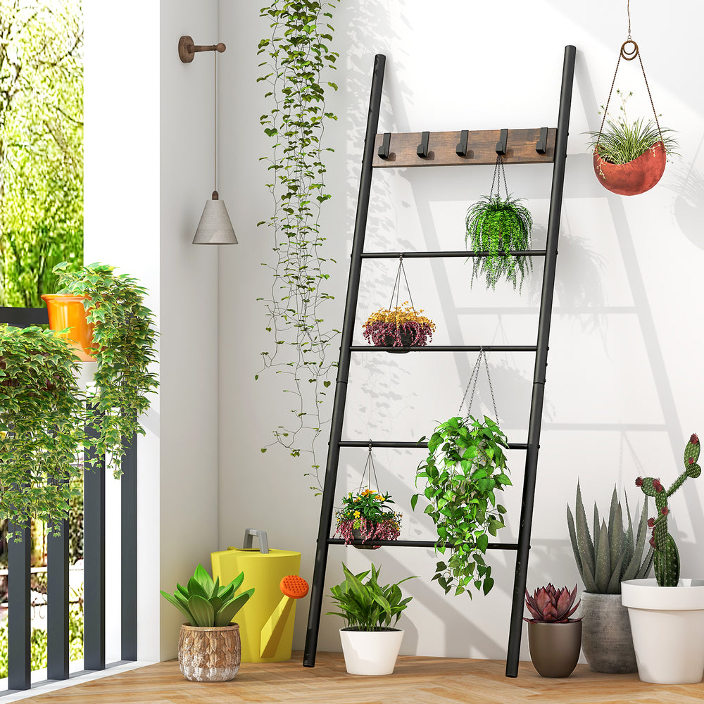 Wall-leaning decorative blanket holder with 5 removable hooks, featuring a durable black metal frame for stylish.