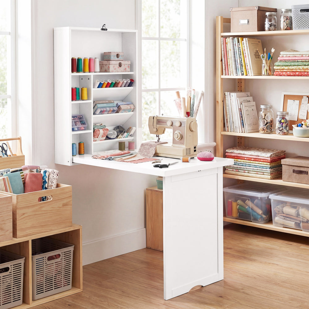 Wall-mounted fold-out desk in white with ample storage and a wide tabletop, ideal for various spaces and needs.