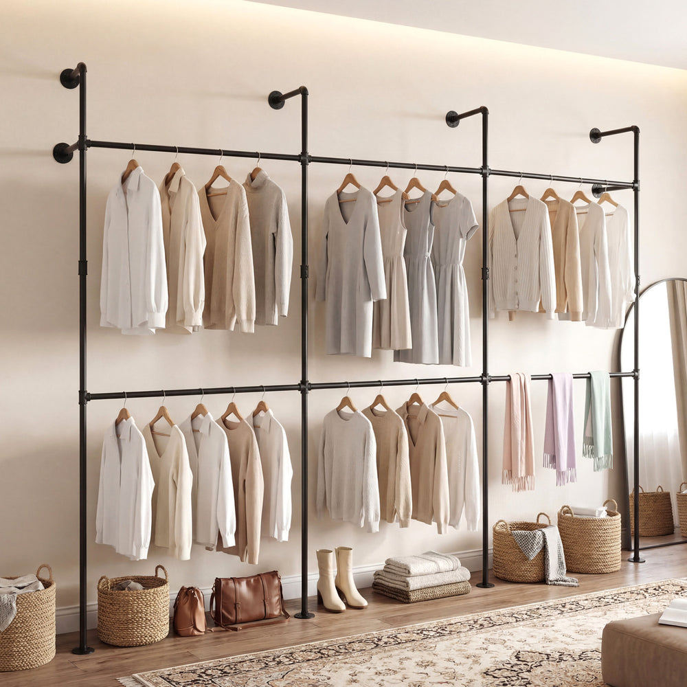 Wall-mounted black clothing rack with 6 hanging rods, designed for organizing coats and dresses in small spaces.