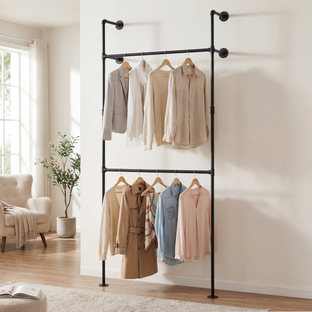 Wall-mounted black clothing rack with two hanging rods, designed for coats and shirts, ideal for closets or retail.