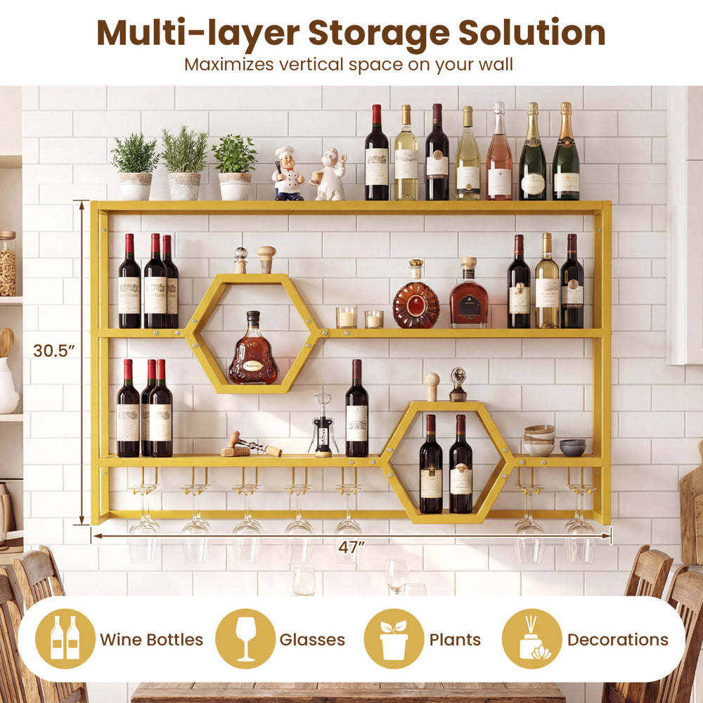 Wall-mounted wine rack in gold with 3 shelves and honeycomb cubbies for stylish storage of wine bottles and glasses.