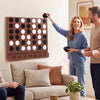 Wall-mounted Jumbo 4-in-a-Row game in walnut finish with sleek acrylic discs, ideal for family fun in game rooms.