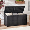 Black waterproof lockable outdoor deck box with cushions, 120-gal capacity, serving as extra bench for outdoor use.