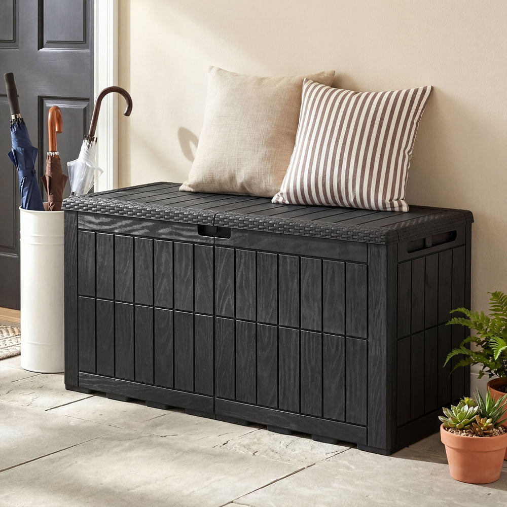 Black waterproof lockable outdoor deck box with cushions, 120 Gal capacity, serving as a bench for outdoor use.