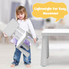 Toddler lifting a lightweight chair from the 3-piece white kids' table and chair set, ideal for play and study.