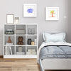 Modern 9-cube bookcase in white, featuring 4 tiers for books and toys, ideal for kids' rooms and easy to clean.